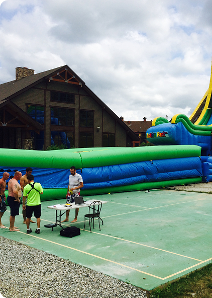 Early inflatable equipment at an outdoor event