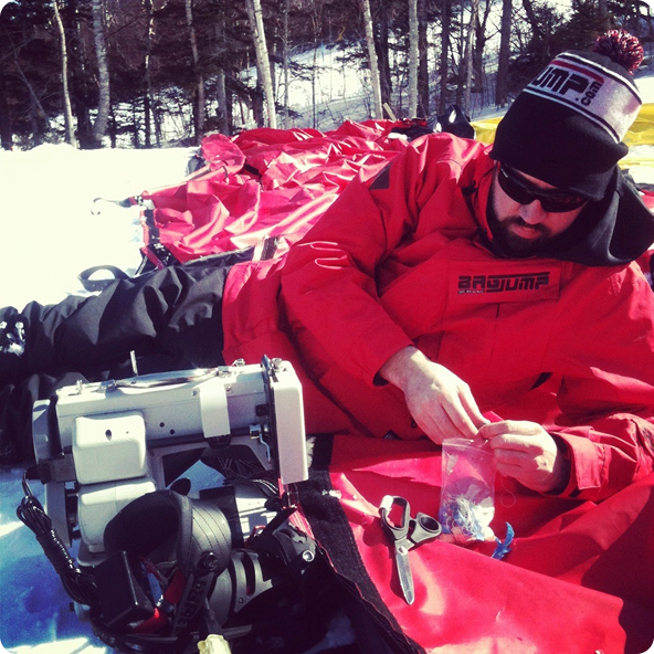 Repairing an airbag on a snowy mountain